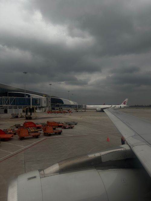 Free Cloudy day view from airplane wing at Guangzhou airport Stock Photo