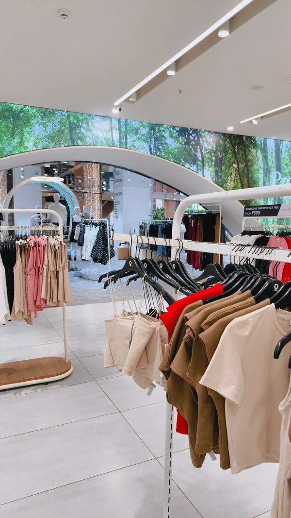 Clothing Store for Sale? Proven Retail Acquisition Guide 2026 1 clothing store for sale bright modern store interior with apparel racks