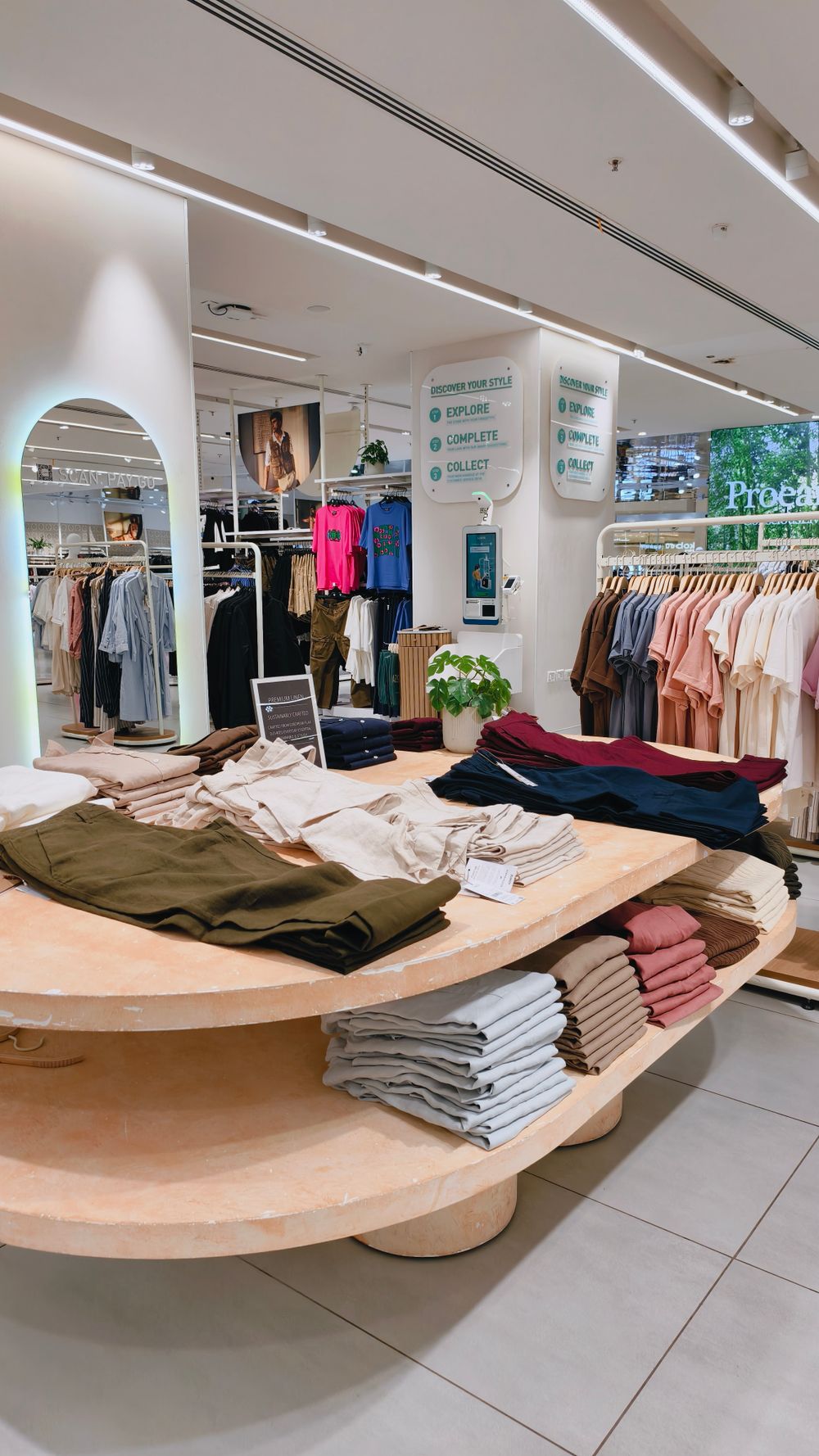 Elegant modern fashion shop interior with organized product displays
