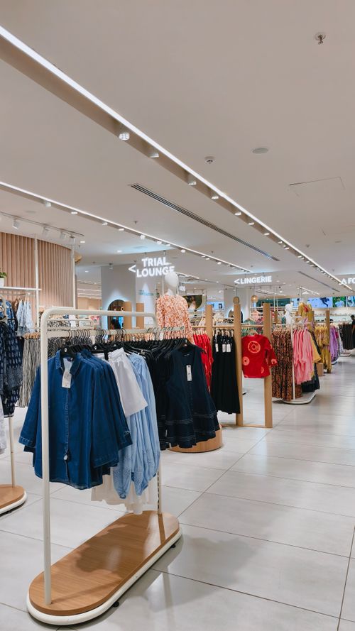 Free Explore stylish clothing in a contemporary fashion retail store interior. Stock Photo