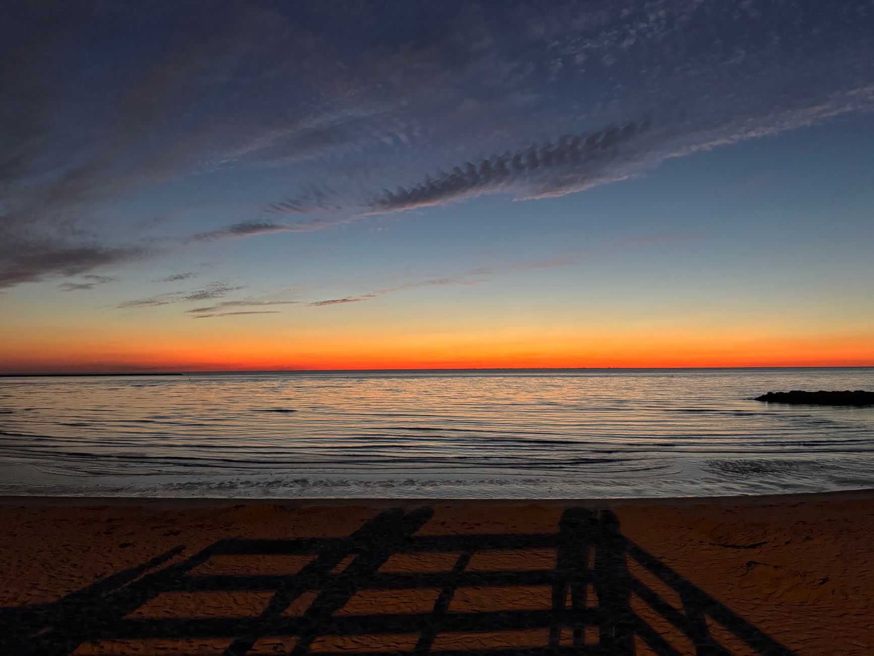 Capture of a beautiful sunset over Chesapeake Bay with serene sea and colorful sky.