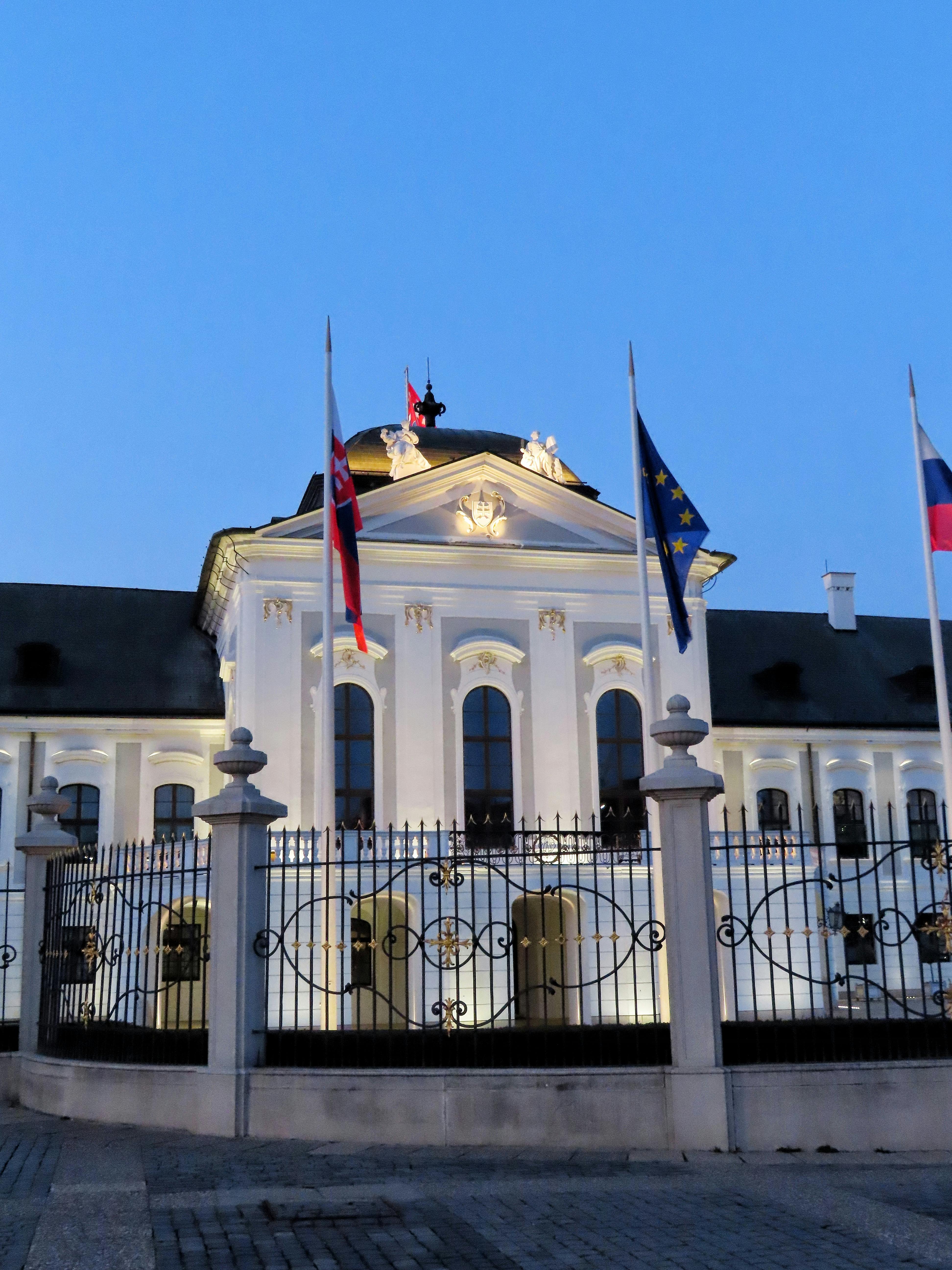 Grassalkovich Palace illuminated at twilight in Bratislava, Slovakia.