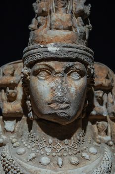 Close-up of an ancient Roman statue bust from Ephesus, showcasing intricate details.