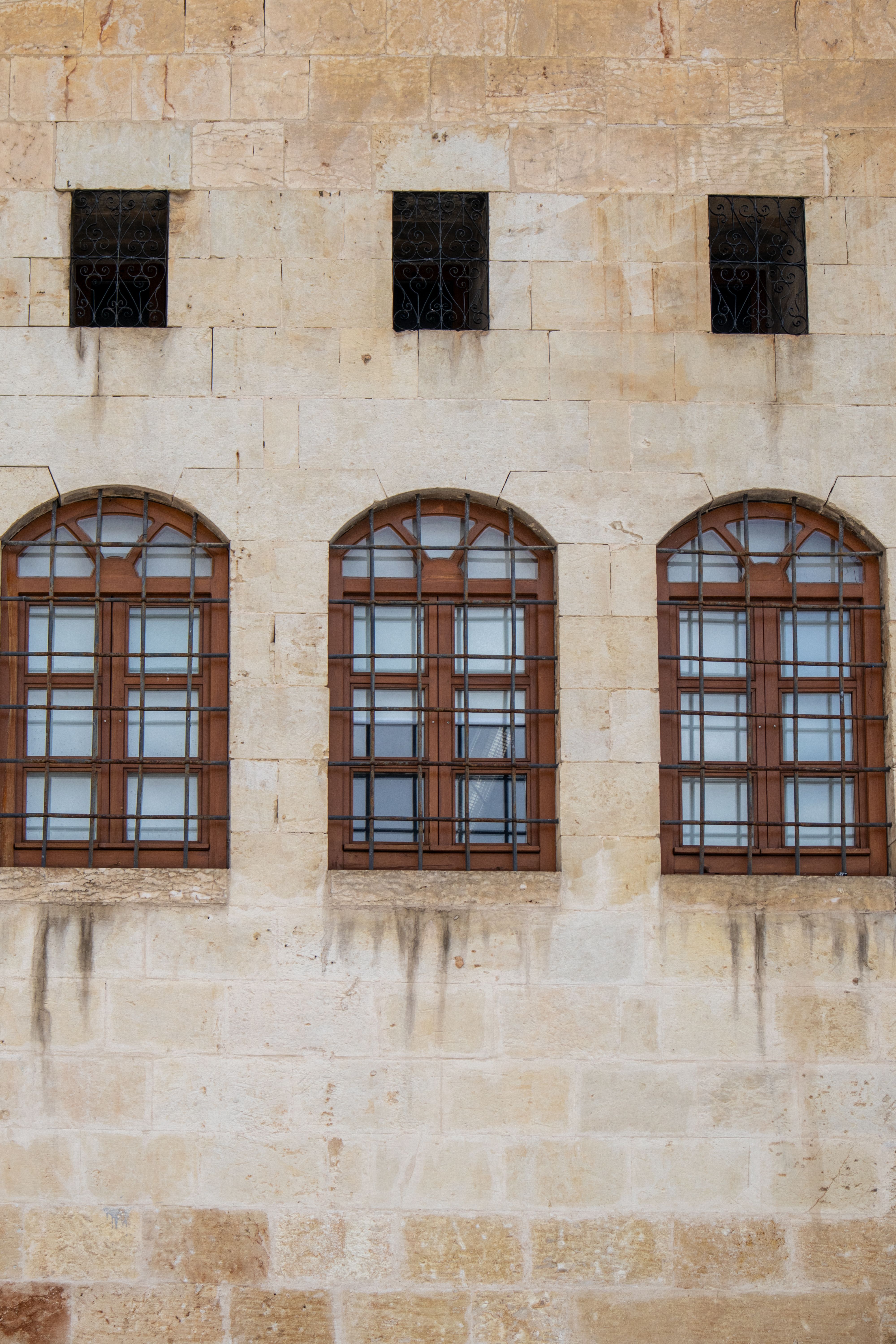 Historic Stone Building with Arched Windows · Free Stock Photo