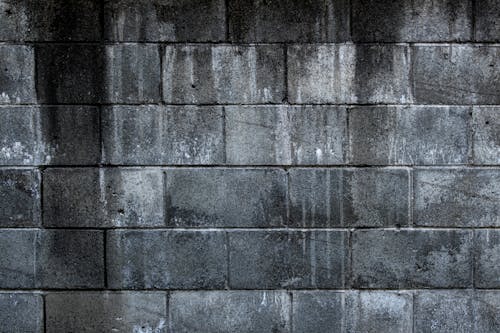 無料 灰色のレンガの壁のクローズアップ写真 写真素材