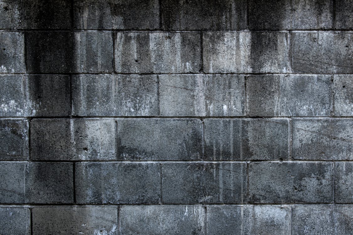 Nahaufnahmefoto Der Grauen Backsteinmauer