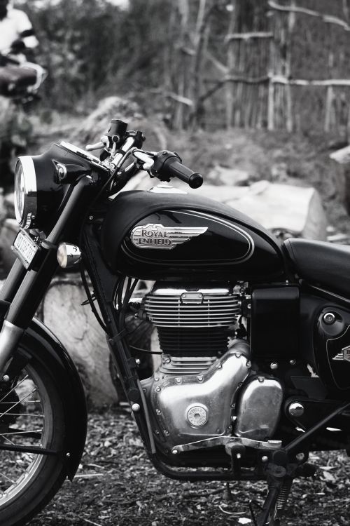 Free Stylish Royal Enfield motorcycle captured in vintage black and white, highlighting its classic design. Stock Photo