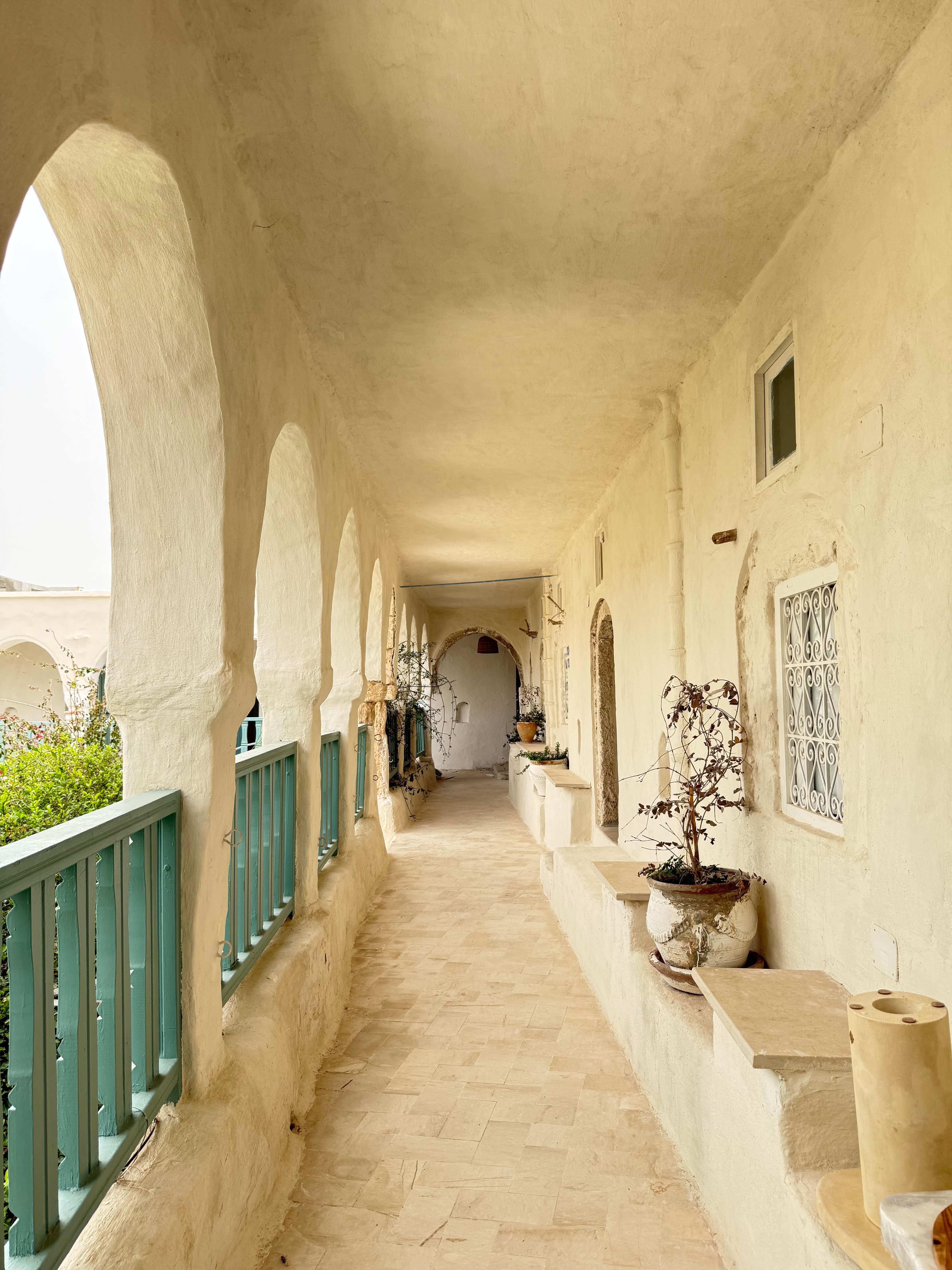 Charming corridor with traditional arches in Houmt Souk, Tunisia.