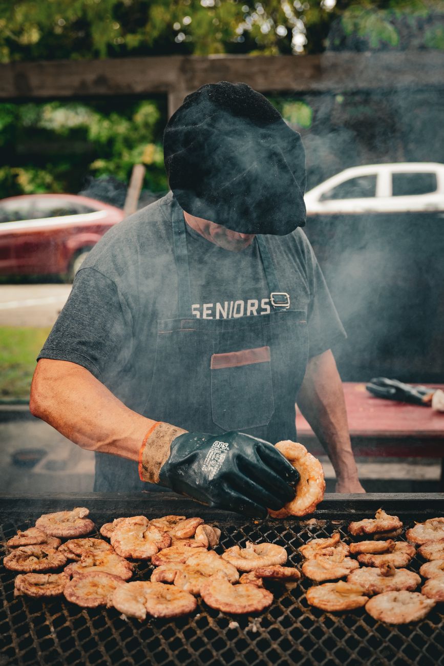 An Argentine chef grills meat on an outdoor barbecue in Uribelarrea.