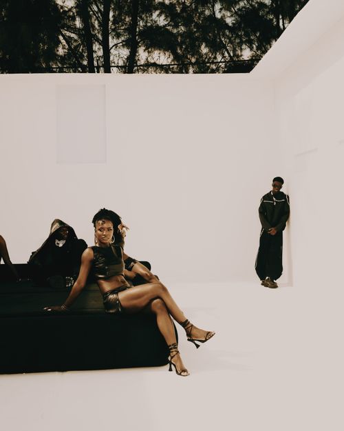 Free Fashionable group in a modern, minimalist white room with a stylish pose. Stock Photo