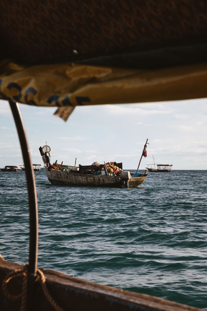 Traditional fishing dhow sailing on the Indian Ocean near Zanzibar