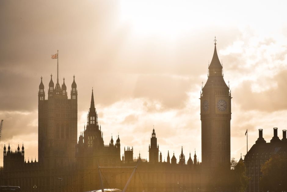 Big Ben and Houses of Parliament silhouette against a stunning sunset in London, UK.