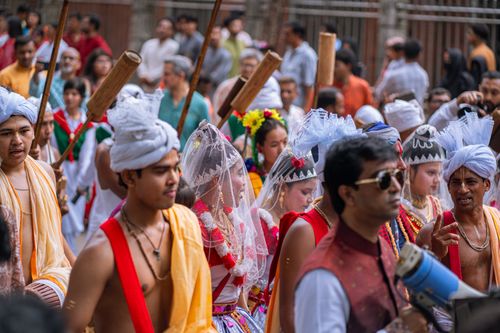 Free Vibrant cultural parade with participants in traditional attire and accessories, capturing the essence of a colorful festival. Stock Photo