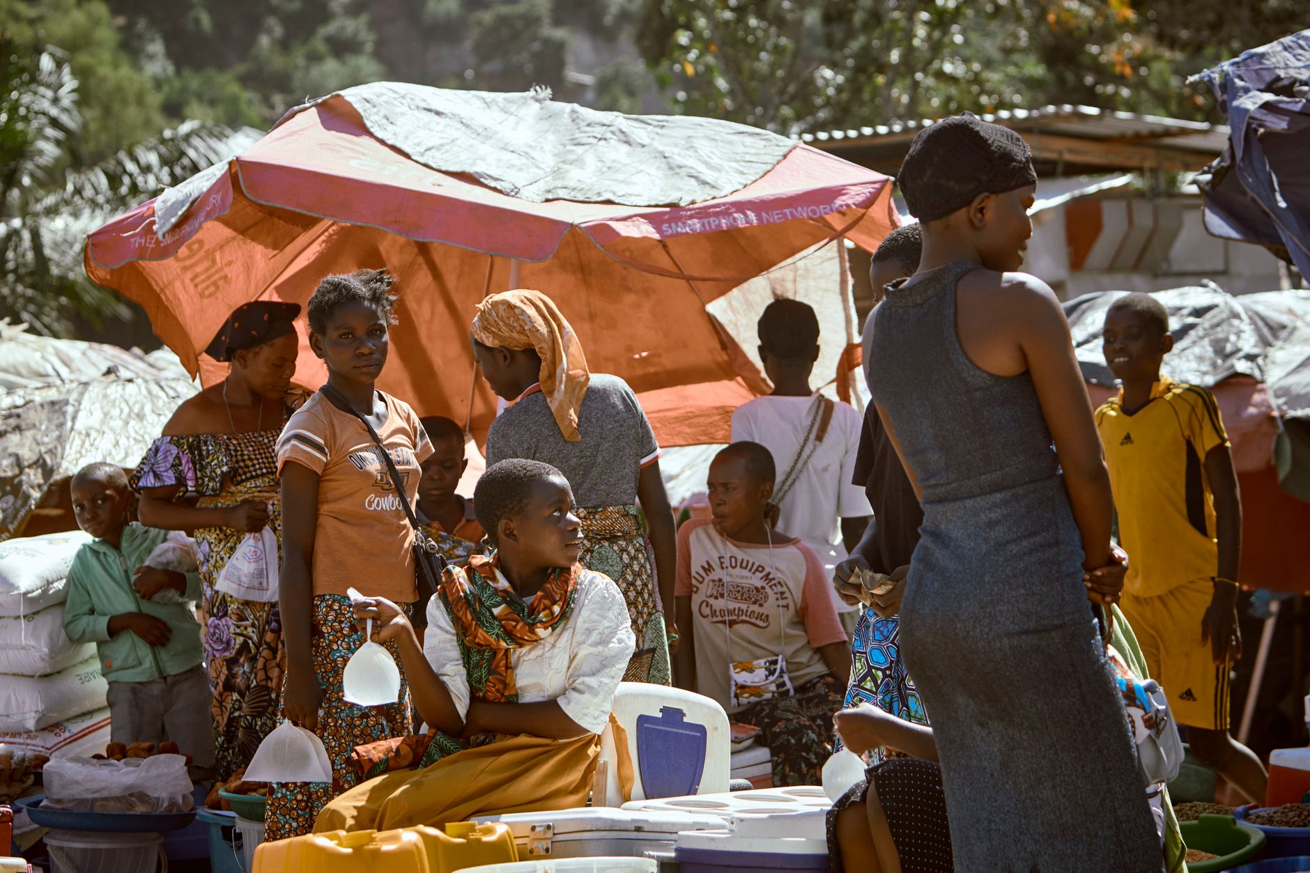 A bustling outdoor market with diverse people, traditional clothing, and vibrant colors. Perfect for cultural and lifestyle portrayals.