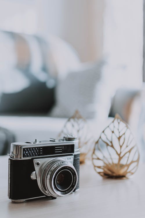 Free Black and Silver Camera on White Table Stock Photo