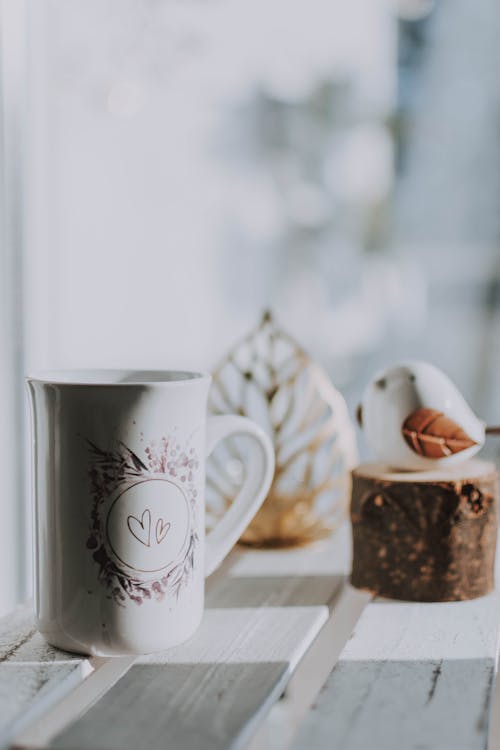 White Ceramic Mug on Wooden Table