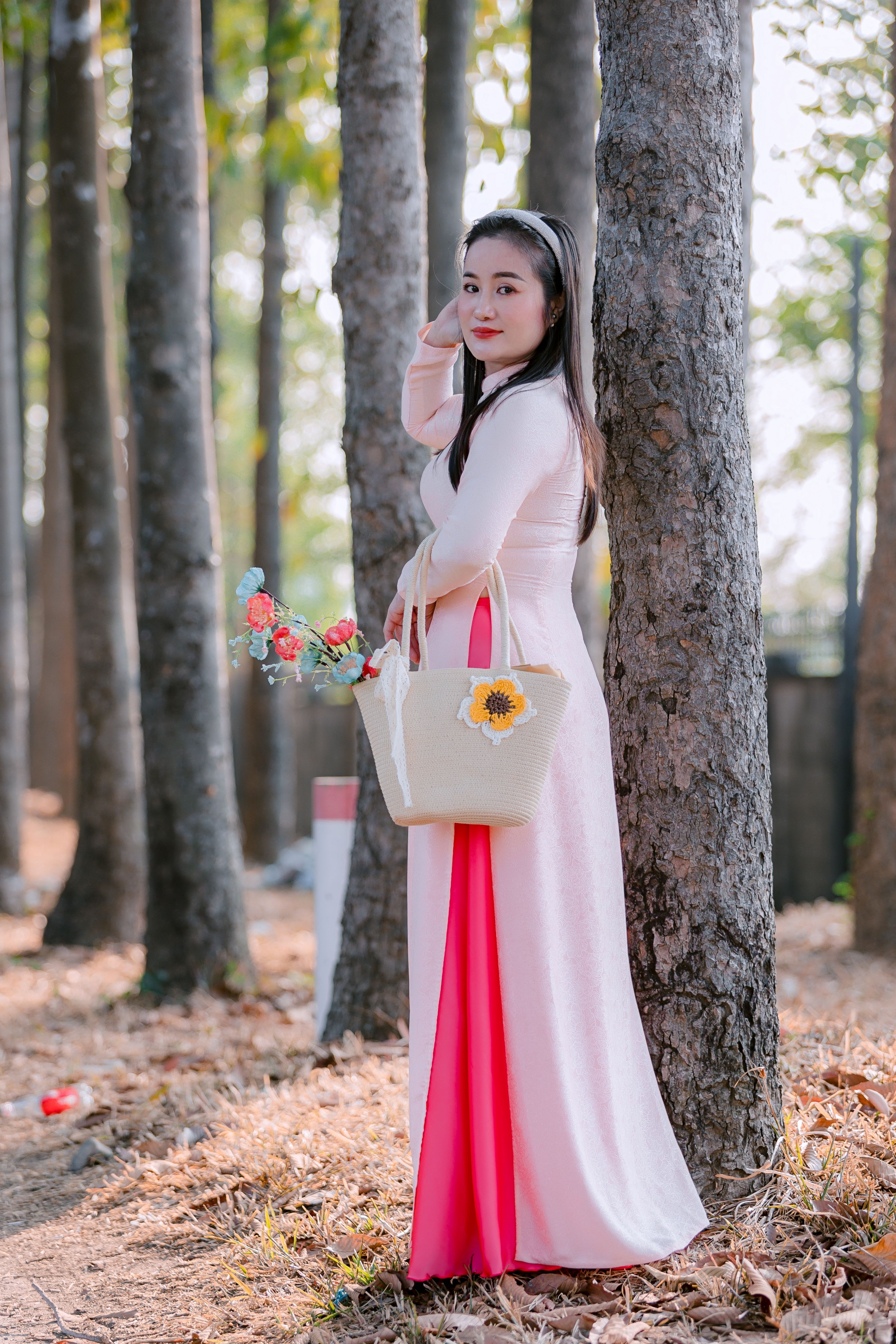 Elegant Woman in Pink Dress Among Forest Trees · Free Stock Photo