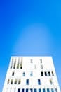 White Concrete Building Under Blue Sky