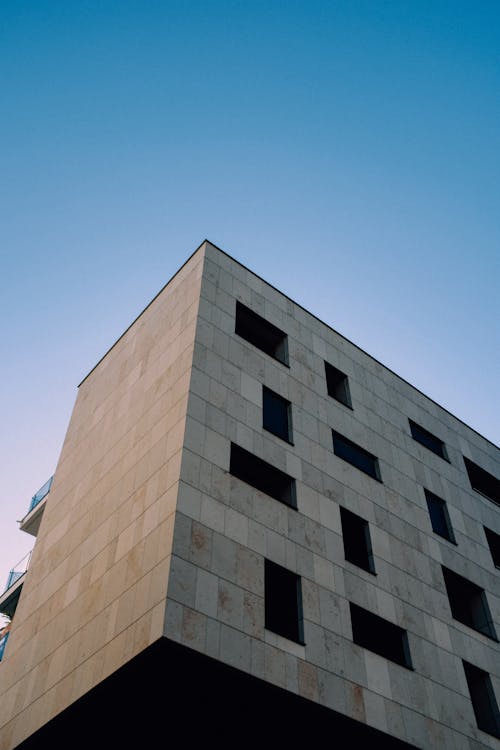 Brown Concrete Building Under Blue Sky