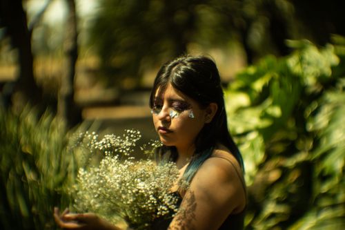 Free A dreamy outdoor portrait of a woman with floral artistic makeup, captured in Mexico City. Stock Photo