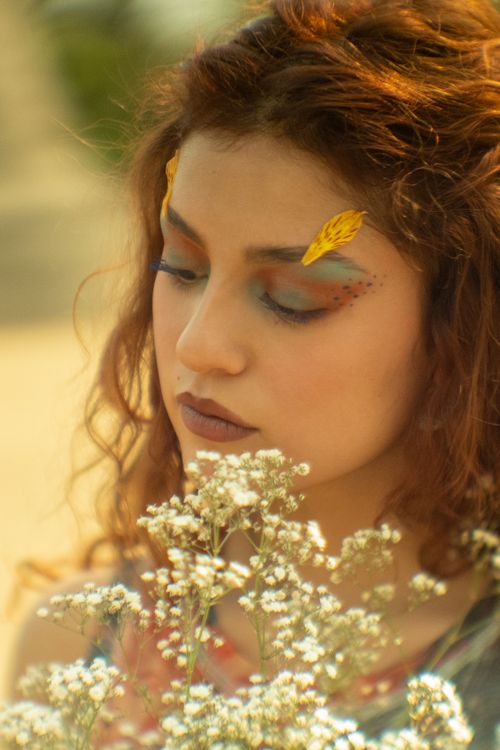 Free A creative portrait of a Latina woman with artistic floral makeup in Chapultepec Park, Mexico City. Stock Photo