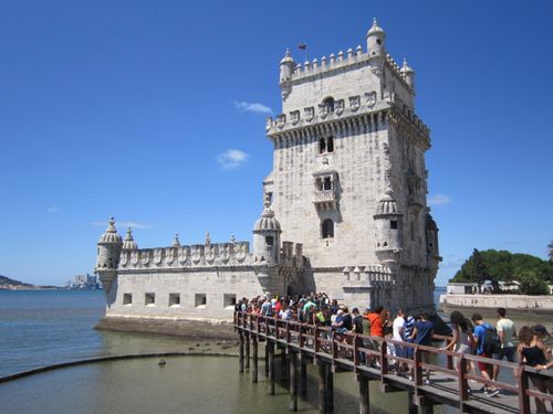 Free Crowds queue at the historic Torre de Belém on a sunny day in Lisbon, Portugal. Stock Photo
