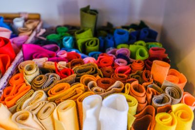 Rolled felt lengths stacked together &mdash; photo by Adrien Olichon on Pexels