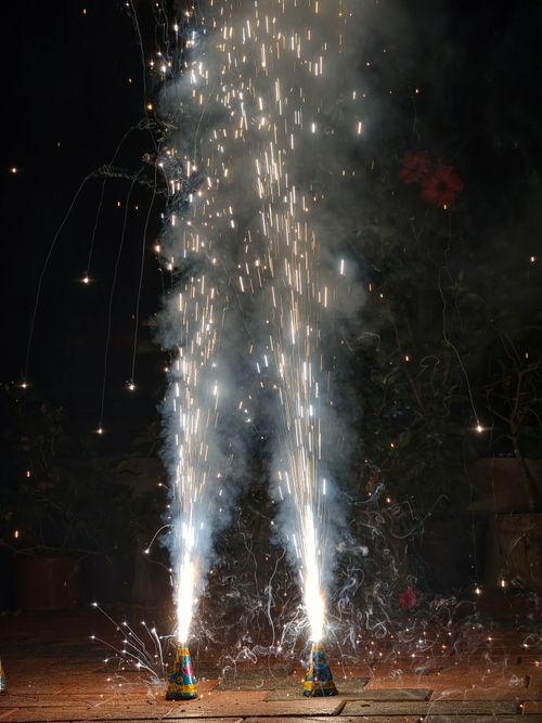 Free Vibrant fireworks light up the night sky during Diwali festivities in India. Stock Photo