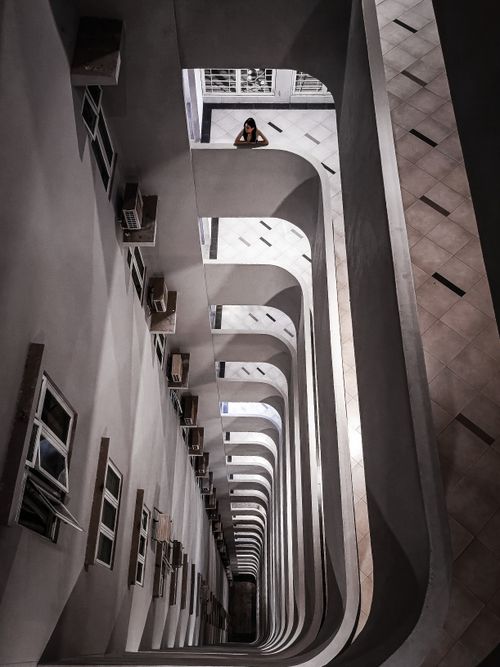 Free Looking down a modern building's atrium with dramatic angles. Stock Photo