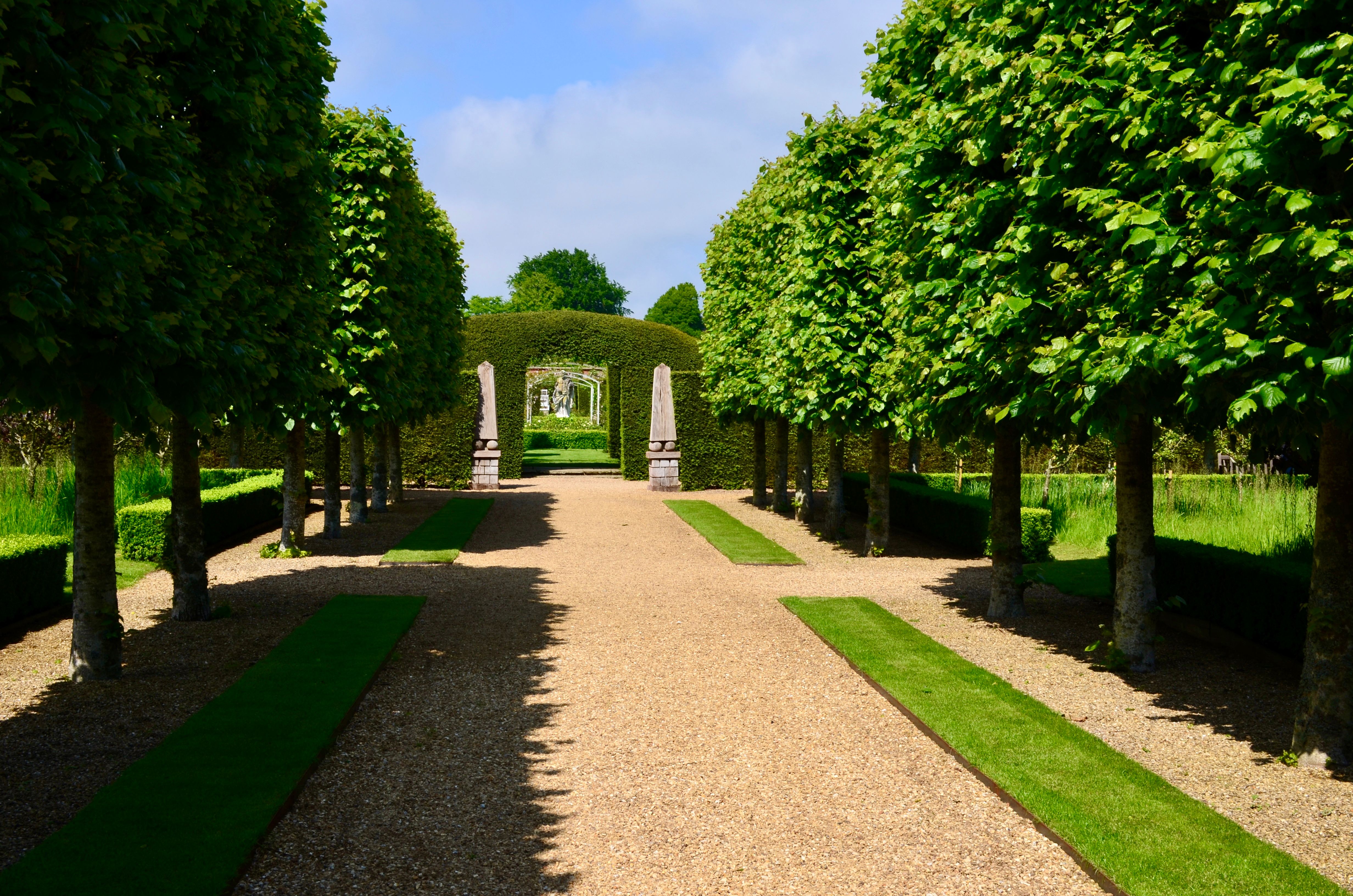 Neatly edged lawn meeting stone pathway