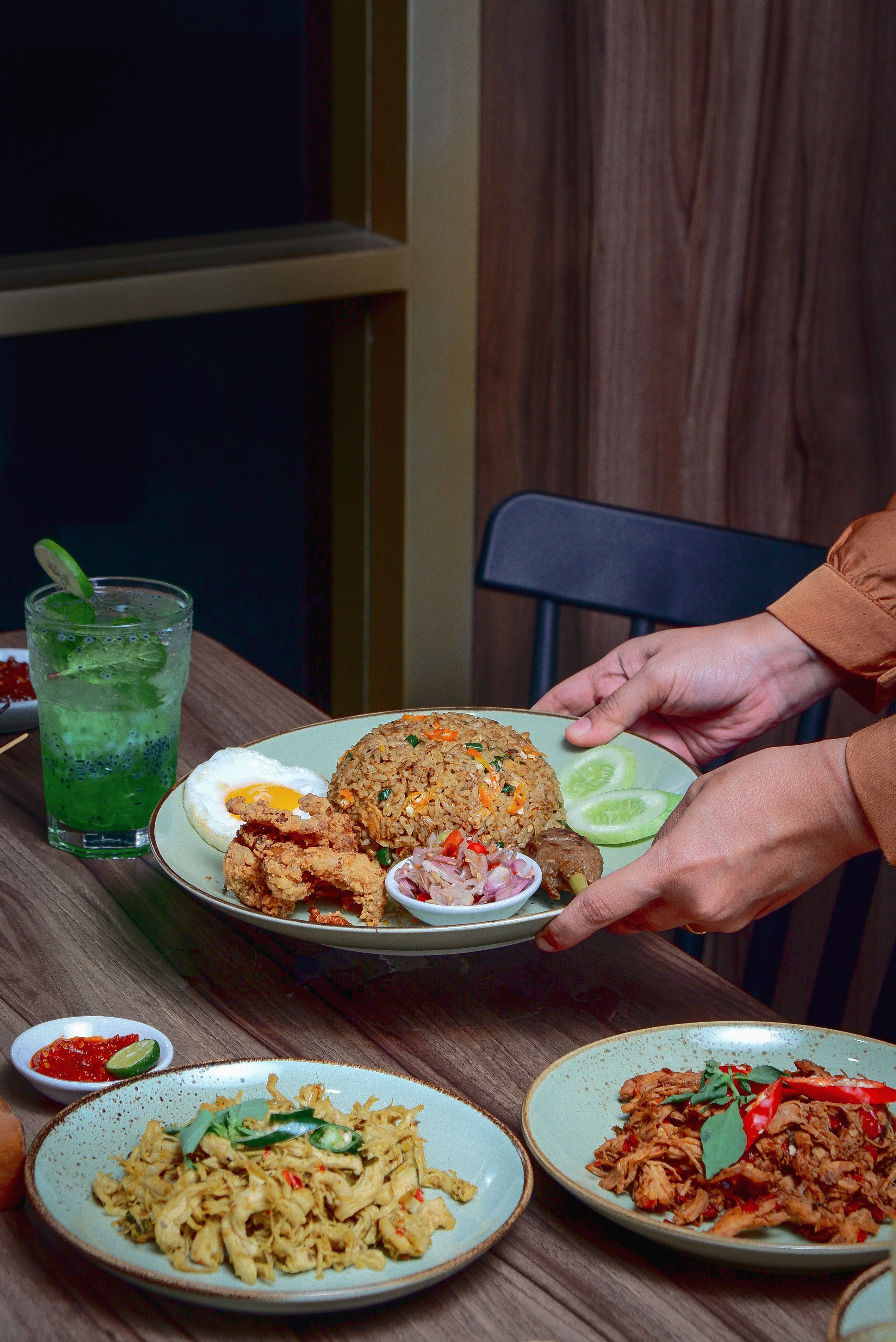 Delicious Asian dishes presented in a cozy restaurant setting with vibrant decor.