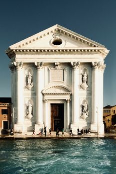 Stunning view of Chiesa dei Gesuati alongside a Venetian canal, showcasing classic Italian architecture.