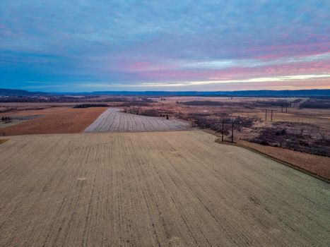 Stunning aerial view of Kellogg, Minnesota fields at sunset showcasing the vibrant countryside.