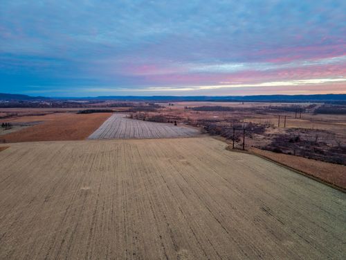 Free Stunning aerial view of Kellogg, Minnesota fields at sunset showcasing the vibrant countryside. Stock Photo