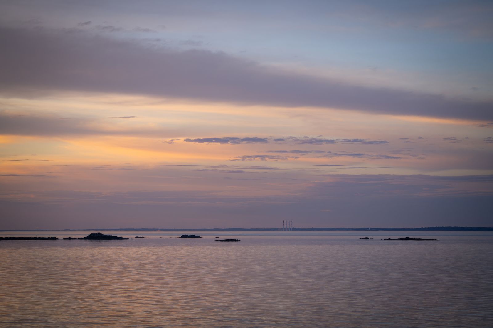 Pastel sunset over a calm sea — photo by Cara Denison on Pexels