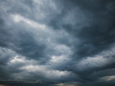 Moody sky with thick storm clouds, capturing the essence of an approaching storm.. moody, with, thick