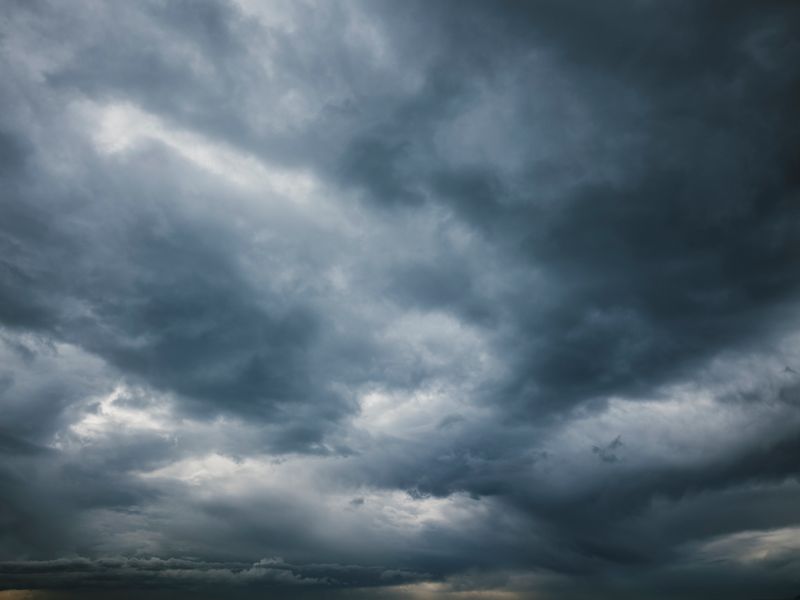 Moody sky with thick storm clouds, capturing the essence of an approaching storm