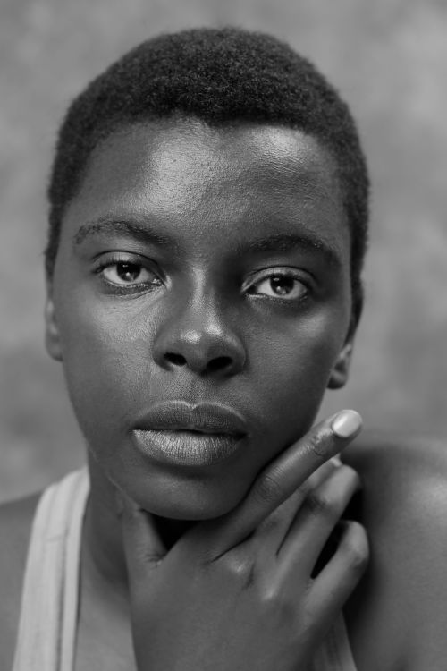 Free Striking black and white portrait of a young adult with a thoughtful expression. Stock Photo