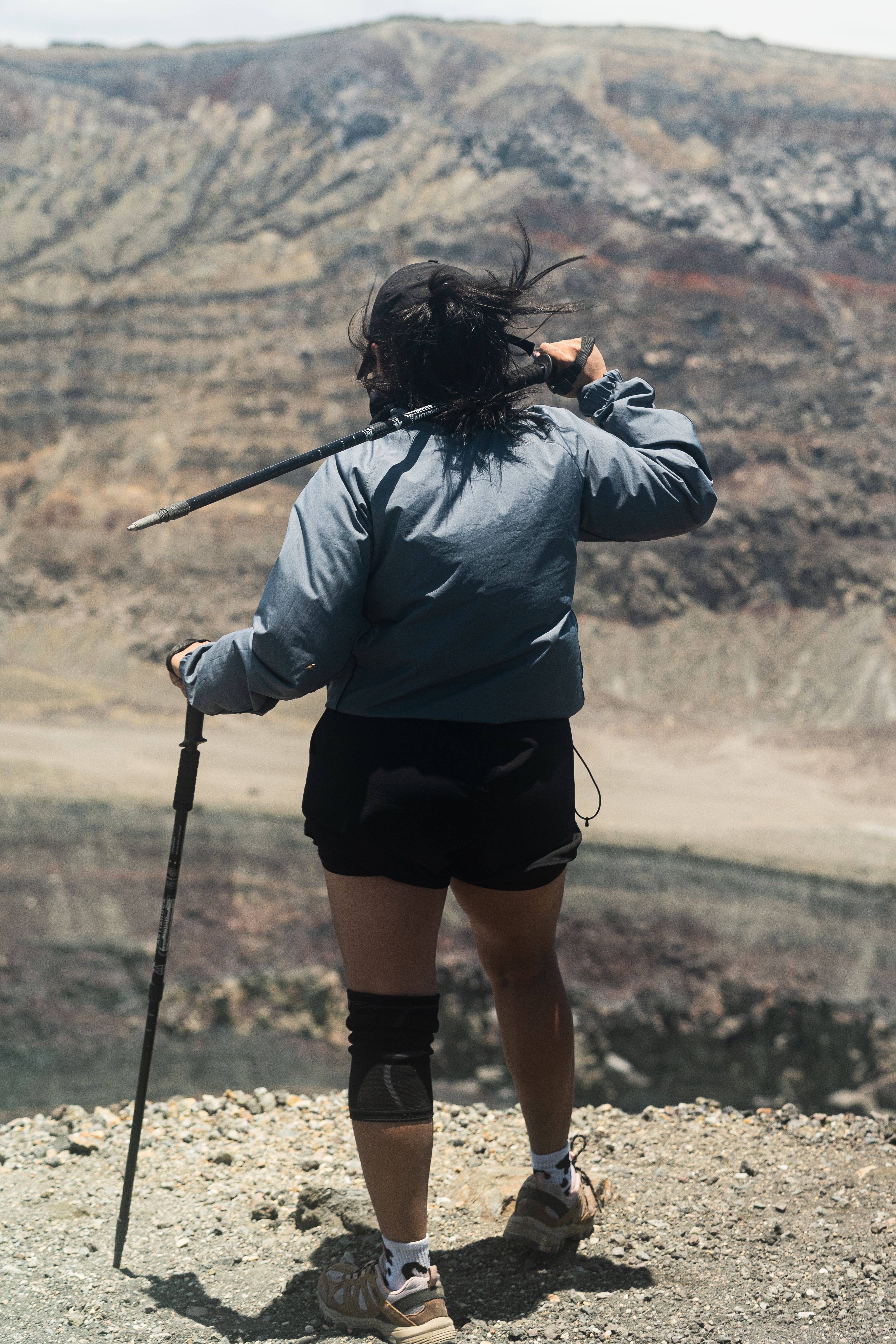 Hiker on Rim of Volcano with Trekking Pole · Free Stock Photo