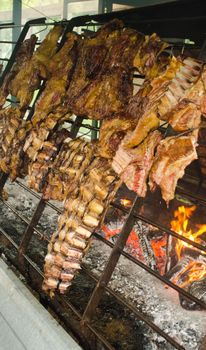 Authentic Argentine asado with ribs cooked over open fire.