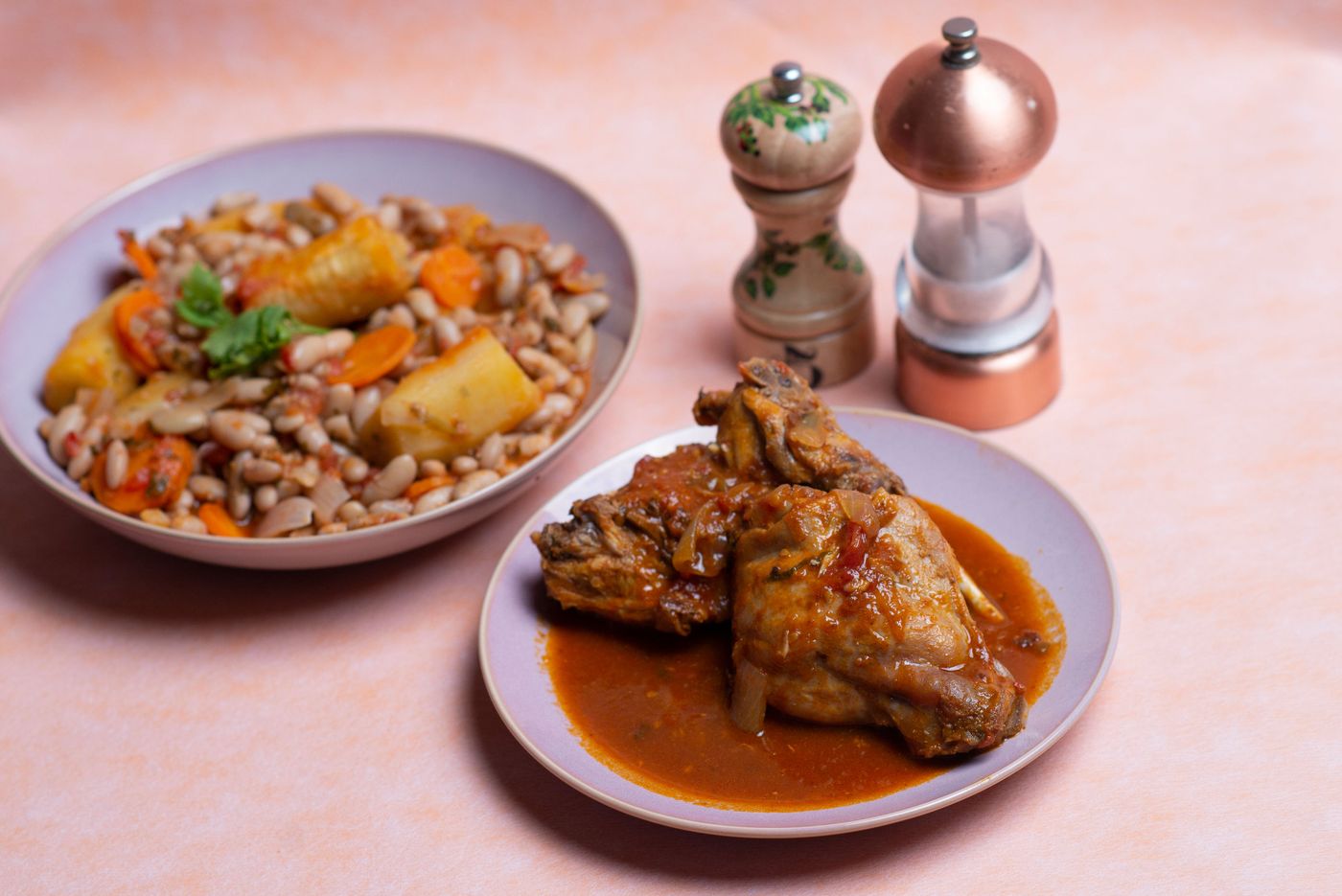 Flavorful African-style chicken stew with beans, carrots, and potatoes, perfect for culinary inspiration.
