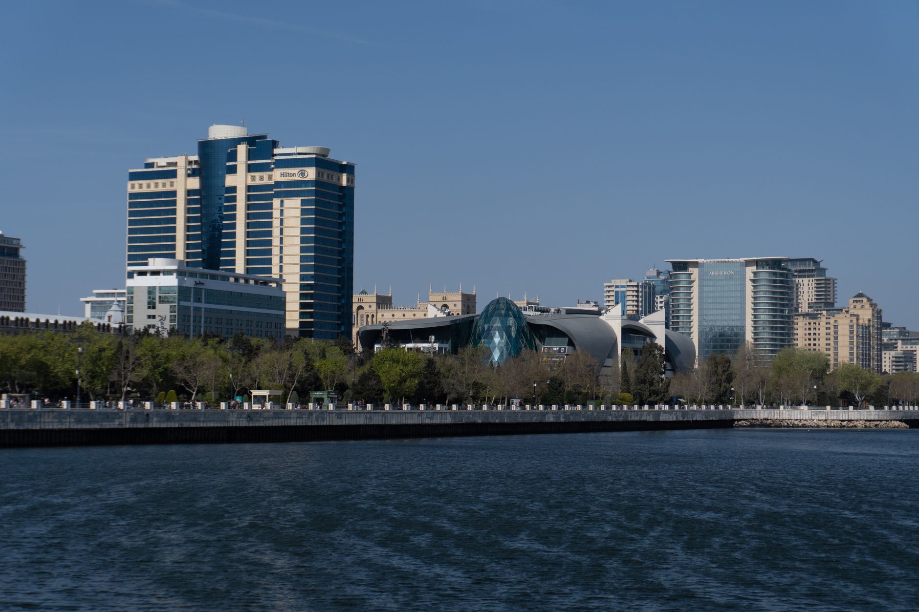 View of Baku's modern skyline with Hilton Hotel and waterfront in daylight. Related image for Market Trends: How Brands Can Improve Performance.