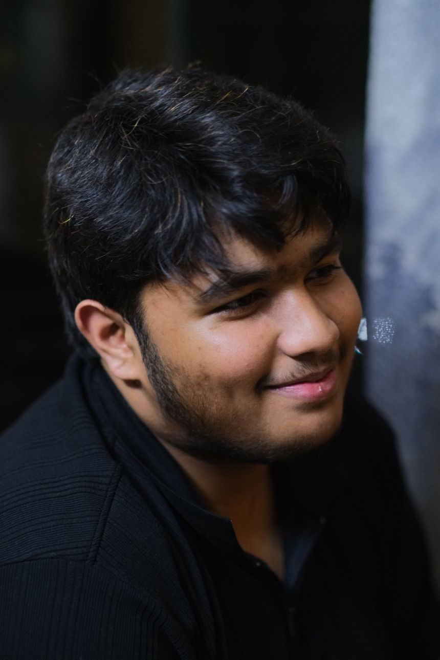 Close-up portrait of a smiling young man — photo by Nowrin Sanjana on Pexels