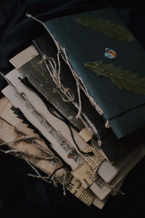 stack of vintage handmade journals tied with rustic twine