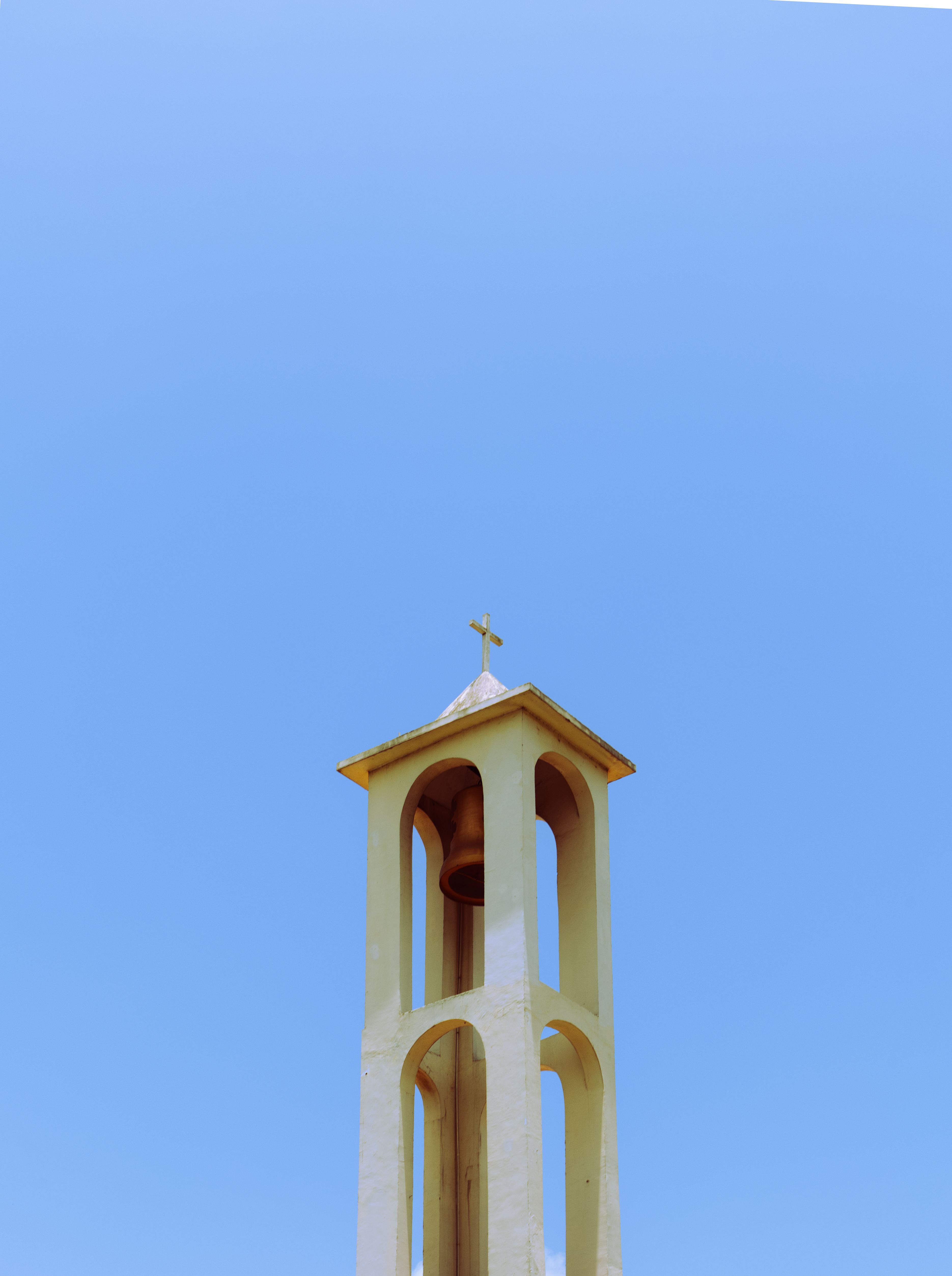 Serene Bell Tower Against Clear Blue Sky · Free Stock Photo