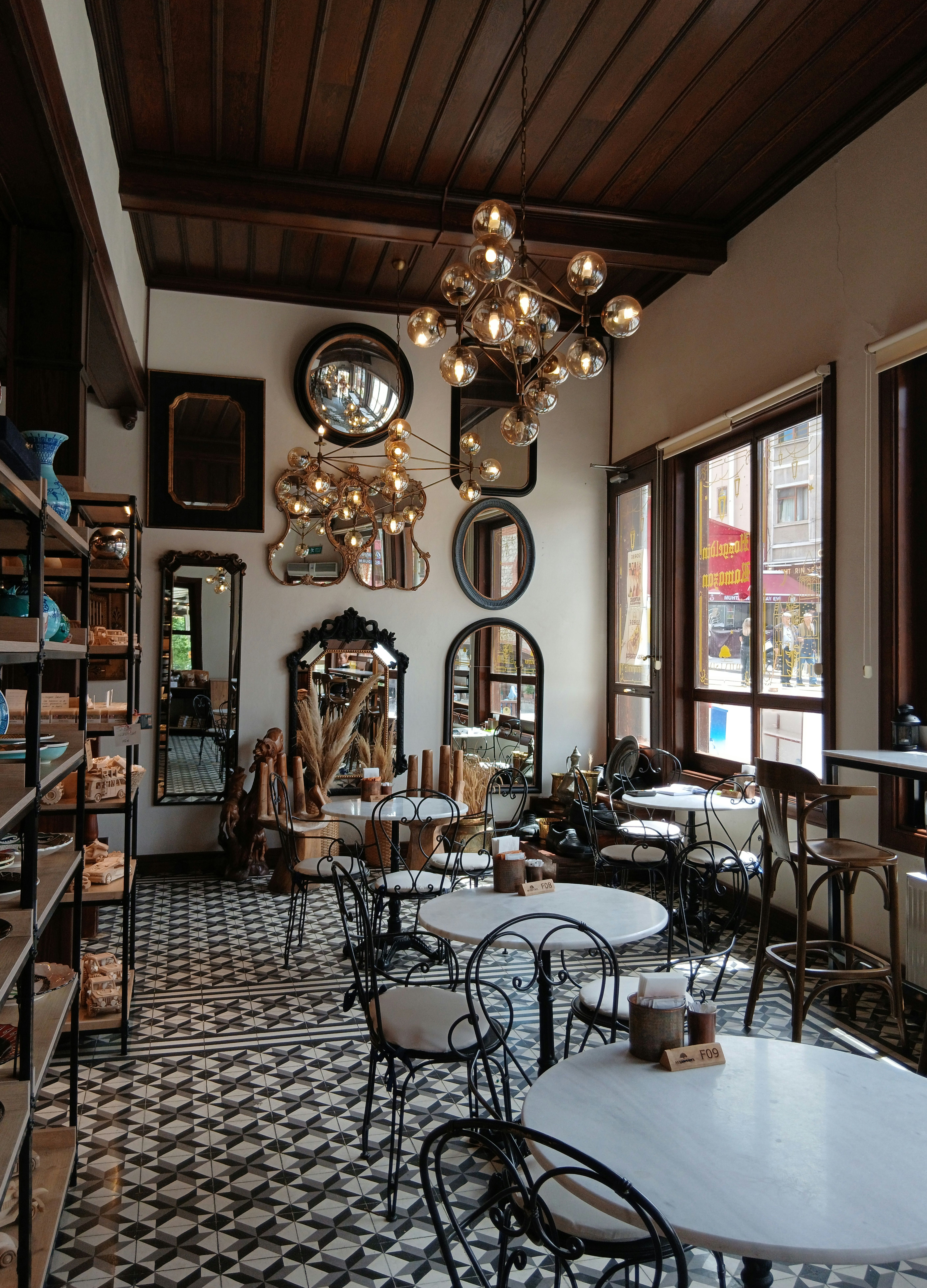 Chic Vintage Cafe with Mirrors and Chandeliers · Free Stock Photo