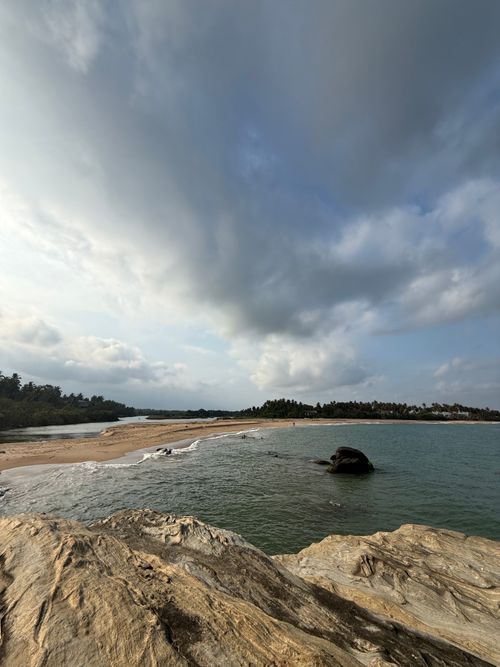 Free Experience the serene beauty of Sri Lanka's coastline with rocky beaches and lush greenery. Stock Photo