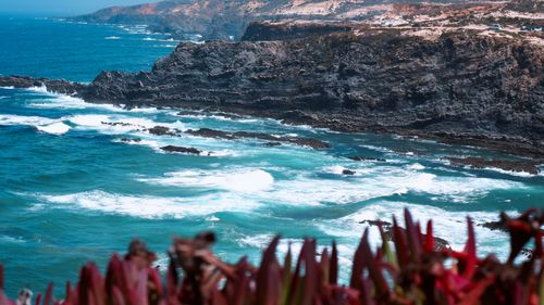 Free Stunning view of rugged cliffs and crashing waves in southern Portugal's Beja District. Stock Photo