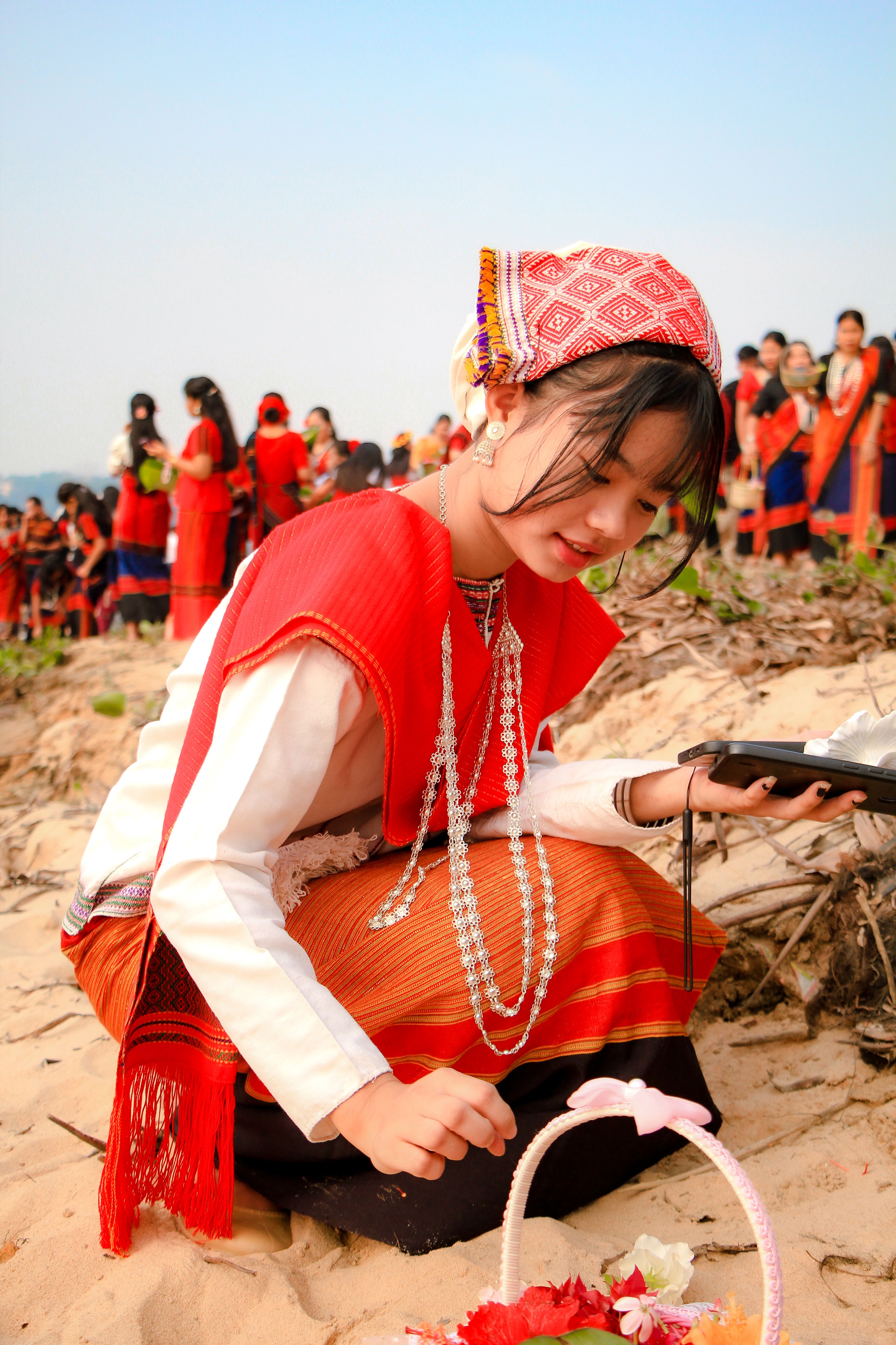 A vibrant cultural festival in Rangamati, featuring traditional attire and floral rituals.