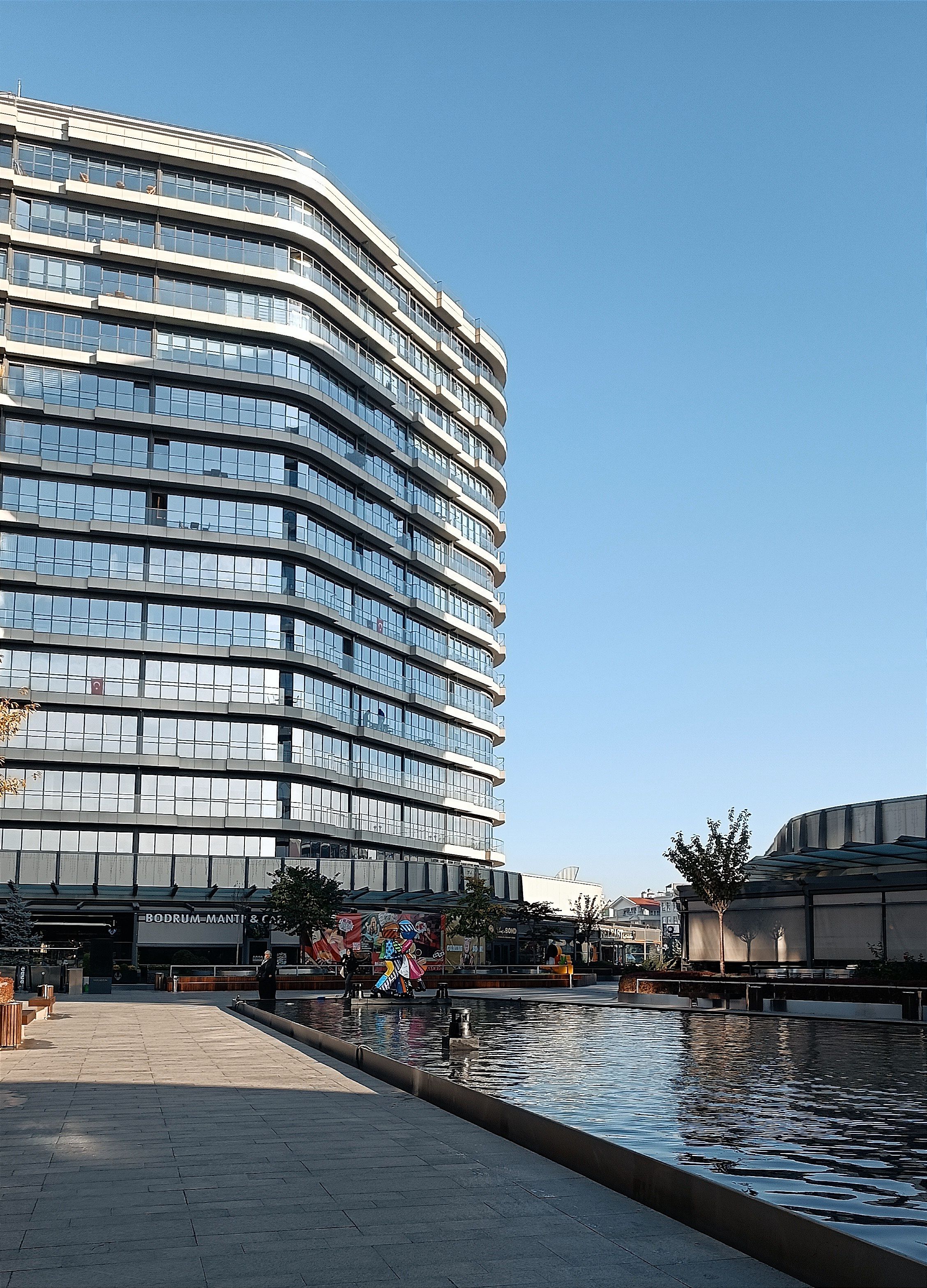 Modern Glass Building Reflected in Water Pool · Free Stock Photo